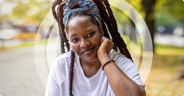 Woman leans on her arm and smiles